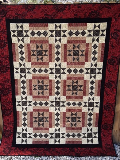 quilt using the star crossed quilt pattern